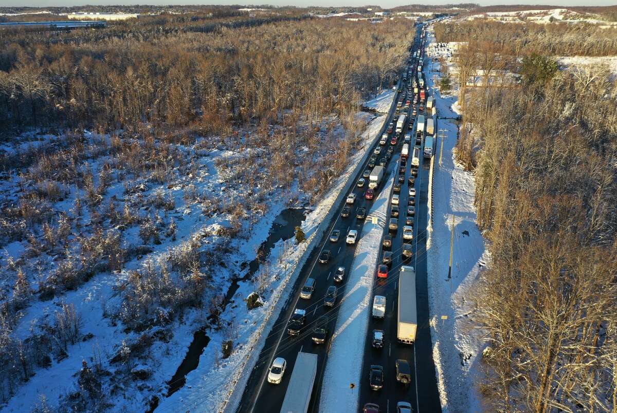 In an aerial view, traffic creeps along Virginia Highway 1 after being diverted away from I-95 after it was closed due to a winter storm on January 04, 2022 near Fredericksburg in Stafford County, Virginia. A winter storm with record snowfall slammed into the Mid-Atlantic states, stranding thousands of motorists overnight on 50 miles of I-95 in Virginia. 