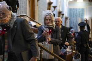 UNITED STATES - JANUARY 6: Rep. Madeleine Dean, D-Pa., Paul Tonko, D-Amsterdam, and other members take cover as protesters disrupt the joint session of Congress to certify the Electoral College vote on Wednesday, January 6, 2021. (Photo By Tom Williams/CQ-Roll Call, Inc via Getty Images)