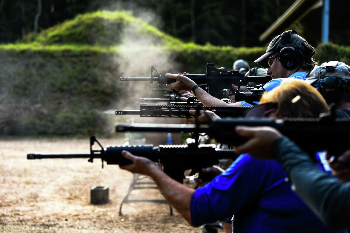 Students fire AR-15 semi-automatic rifles during a shooting course at Boondocks Firearms Academy in Jackson, Mississippi on September 26, 2020.