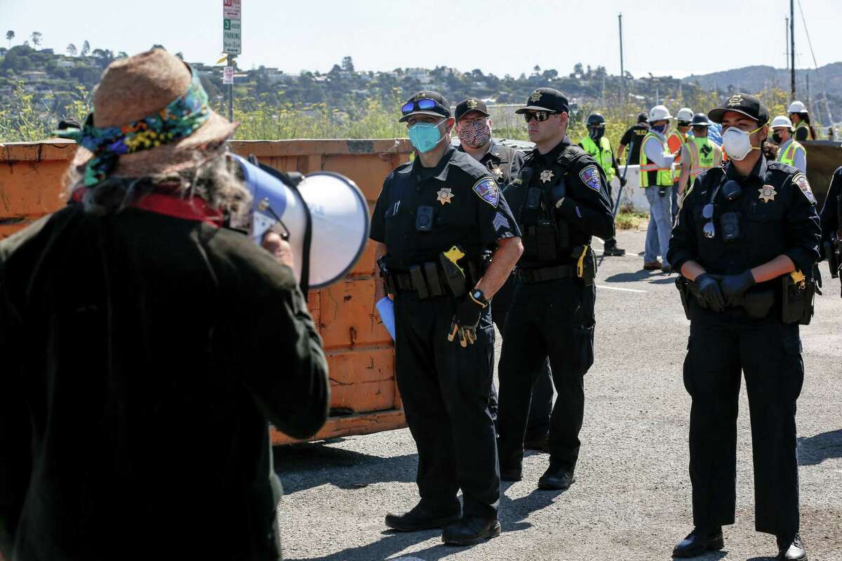 Police forcibly move homeless residents from Dunphy Park to Marinship Park in Sausalito on June 29, 2021. Photojournalist Jeremy Portje was working on a documentary in a Sausalito homeless camp on Nov. 30, 2021, when police arrested him and seized his phone and equipment.