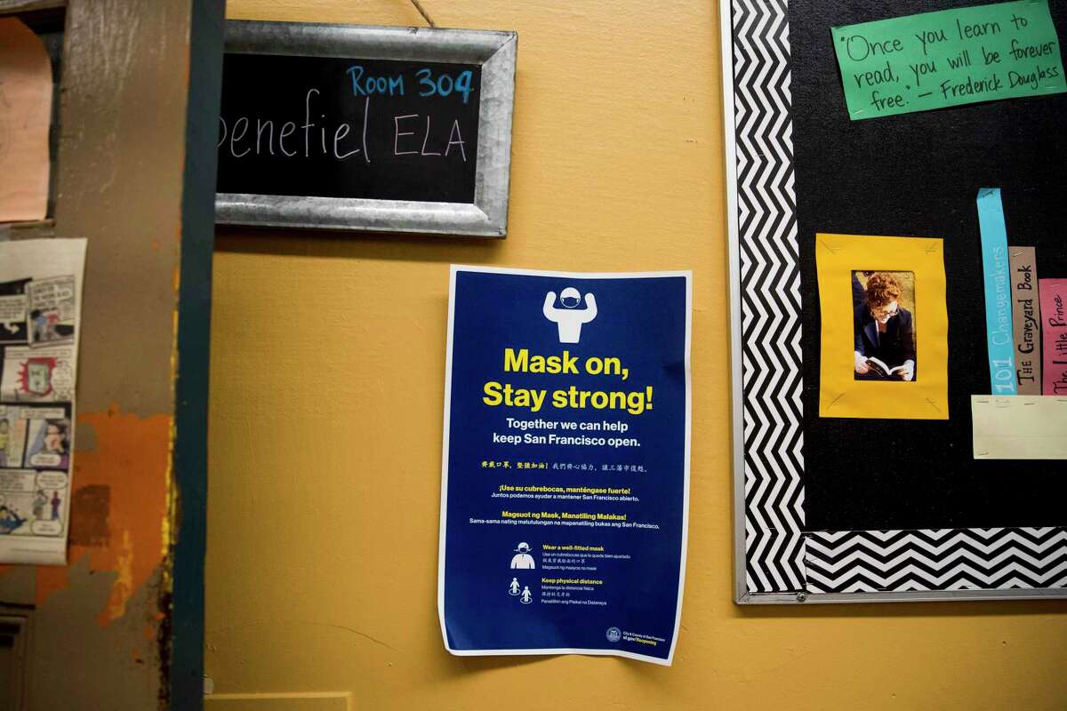 Posters at Everett Middle School remind of the importance of masks. The mask signs at Everett Middle School, Tuesday, Jan. 4, 2022, in San Francisco, Calif.