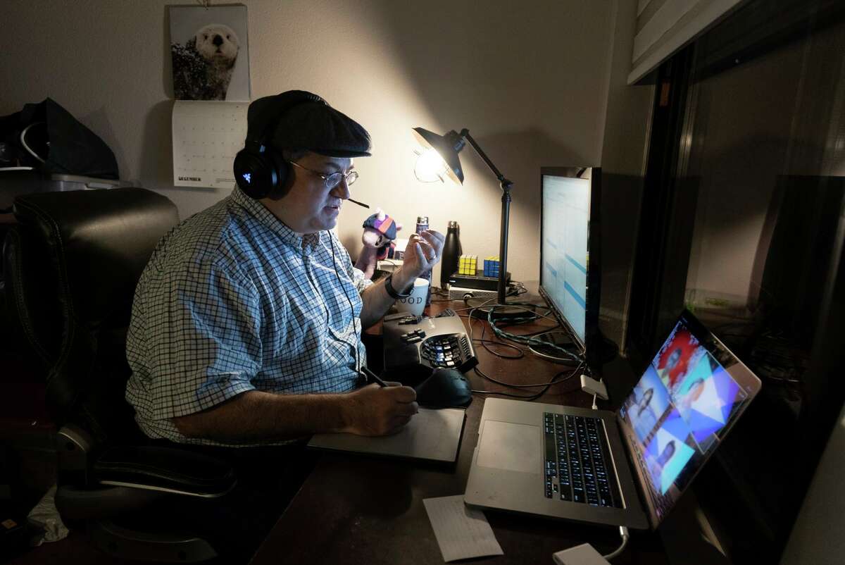 Brent Edwards takes a Zoom call while working at home in San Jose. He is moving with his wife, who has a new job in L.A.
