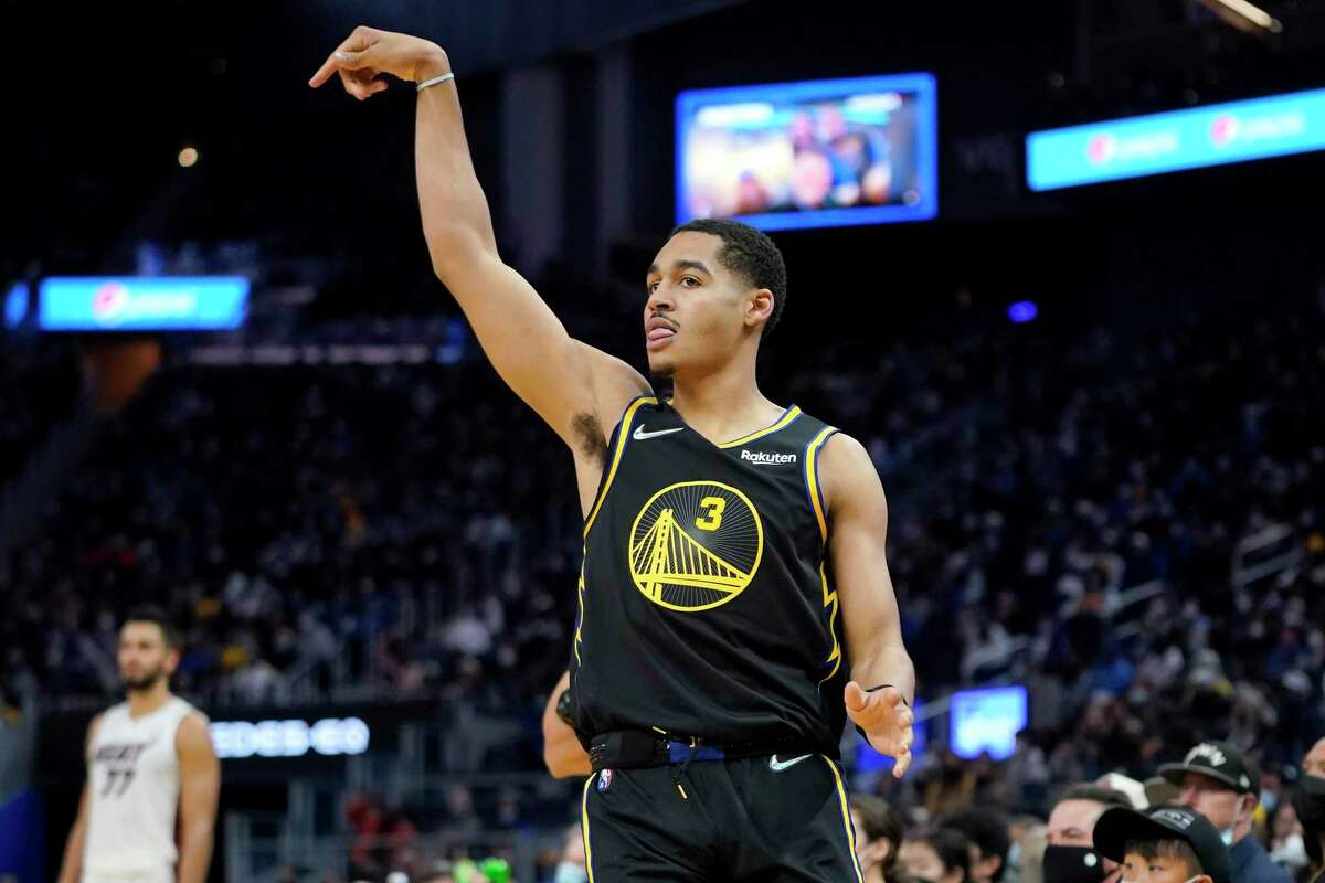 Golden State Warriors guard Jordan Poole (3) celebrates after shooting a 3-point basket against the Miami Heat during the second half of an NBA basketball game in San Francisco, Monday, Jan. 3, 2022. (AP Photo/Jeff Chiu)