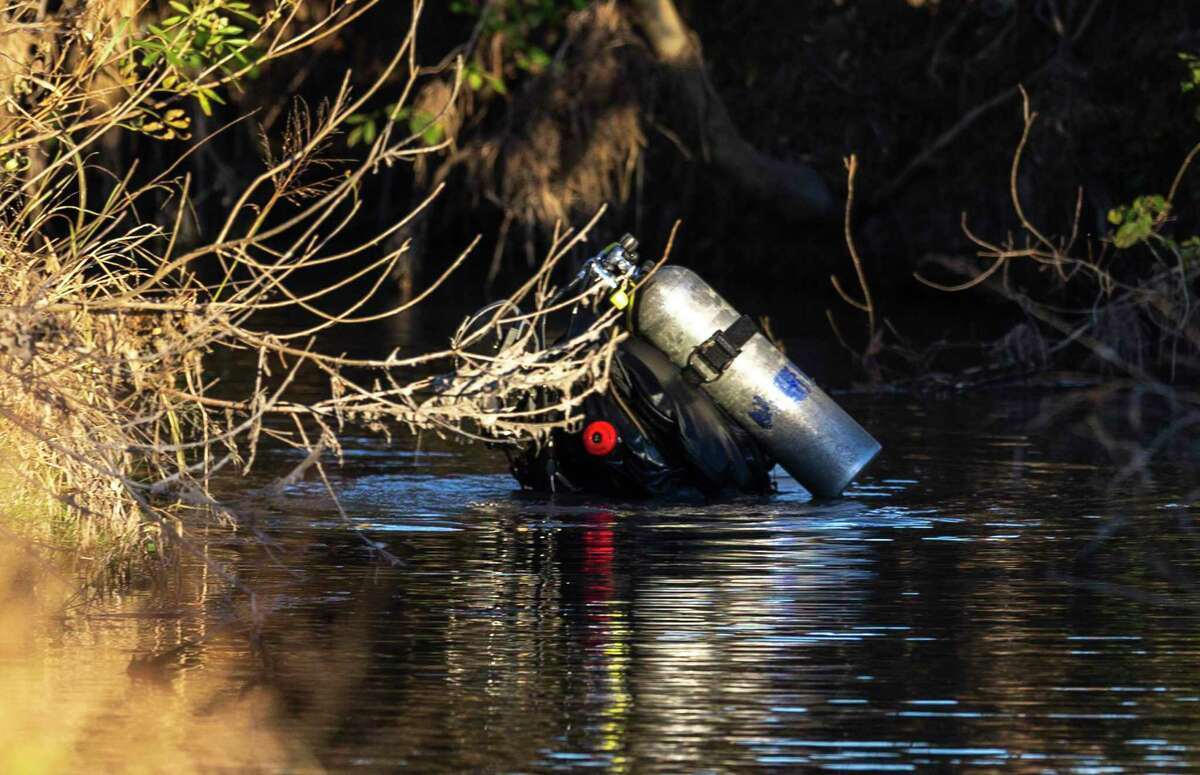 A diver searches Tuesday, January 4, near the 5700 block of Babcock Road for missing 3-year-old Lina Khil.
