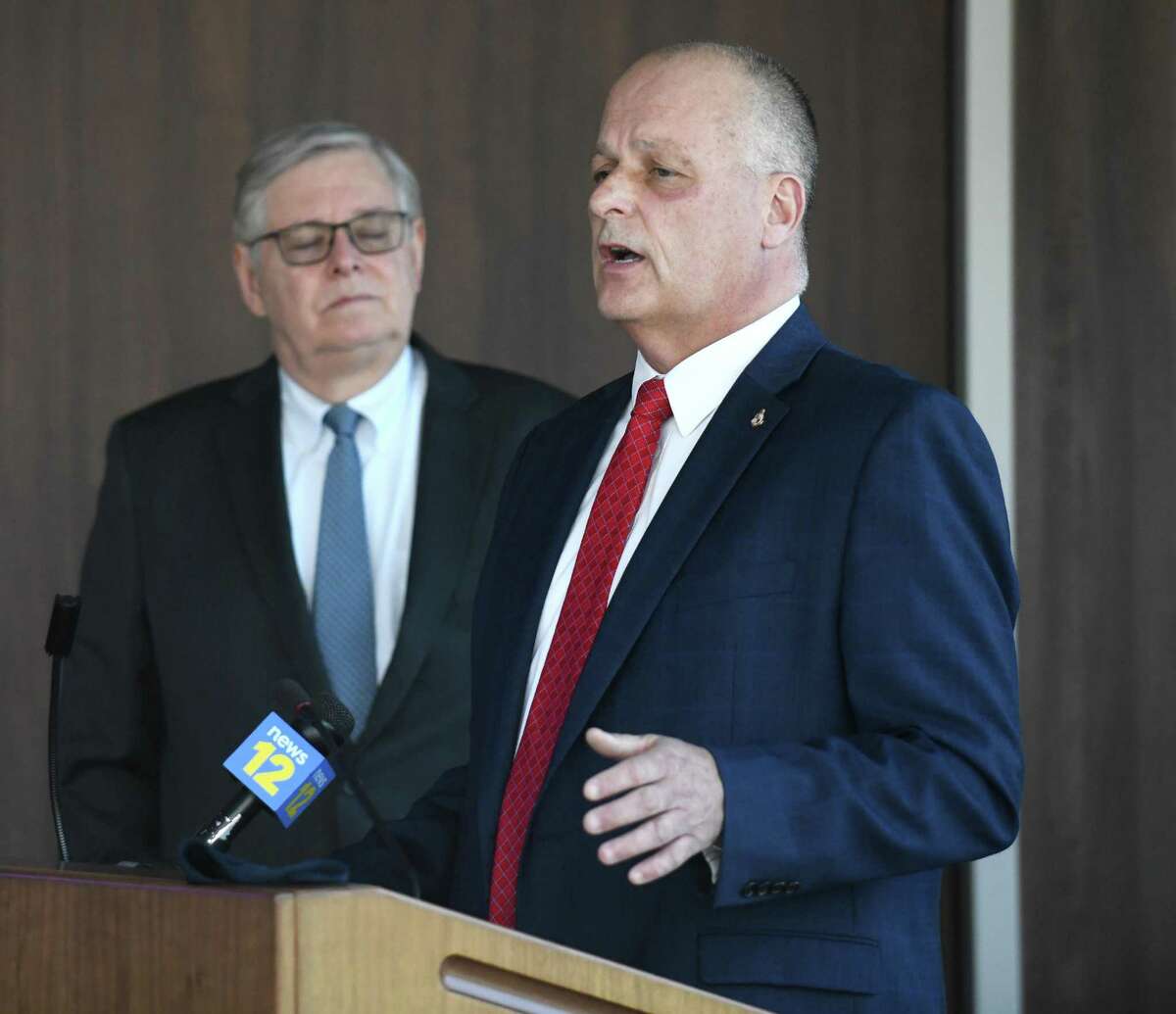 Stamford Director of Public Safety Ted Jankowski, right, speaks beside then-Mayor David Martin about mental health initiatives in policing at the Stamford Police Department in Stamford, Conn., on May 12, 2021.