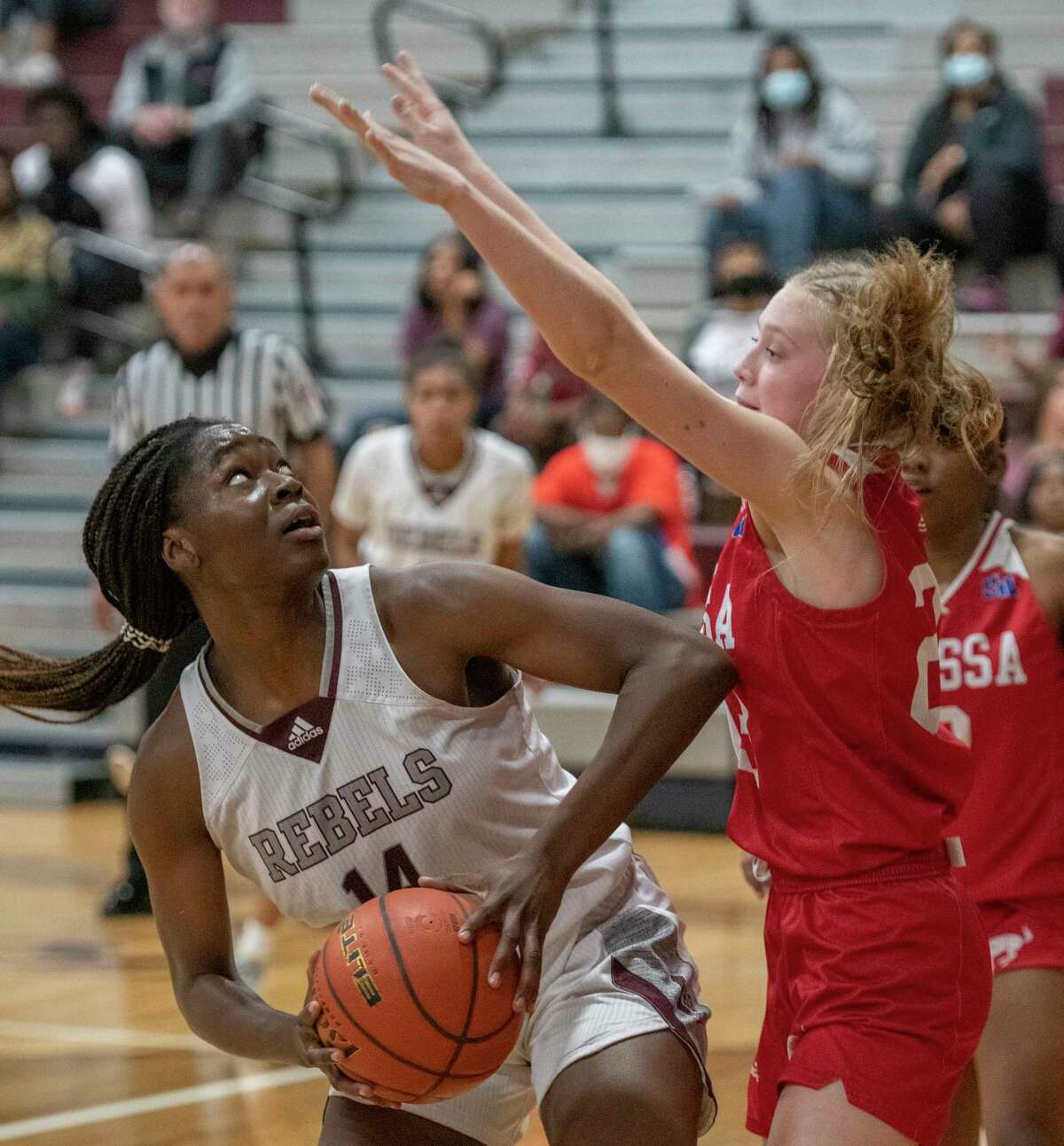 Legacy High's Loredana Fouonji looks to put up a shot as Odessa High's Paige Byford defends 01/04/2022 at Legacy High gym. Tim Fischer/Reporter-Telegram