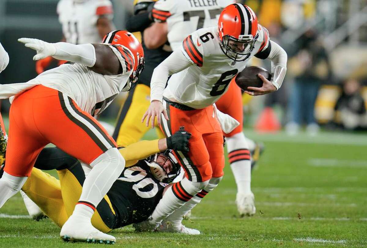Steelers linebacker T.J. Watt brings down Browns quarterback Baker Mayfield, one of nine sacks in Monday night’s game.