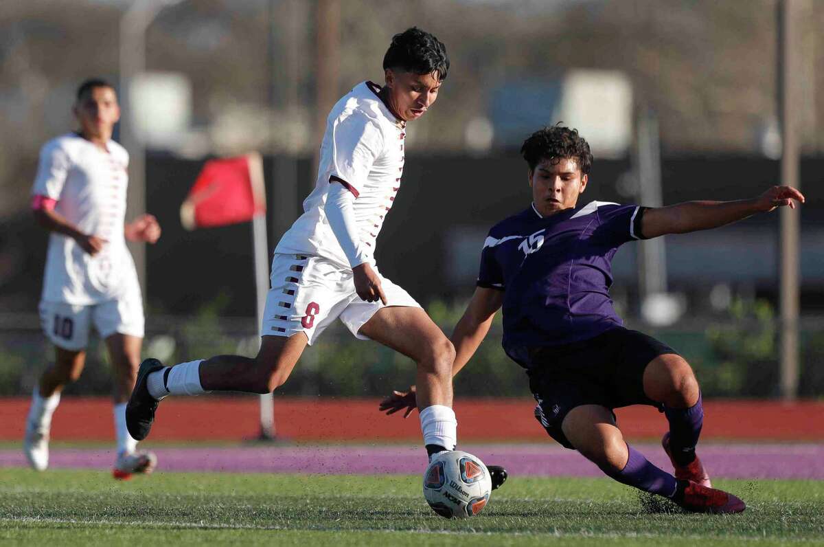 Willis' Israel Mentado (15) tackles against Magnolia West's Edgar Garcia (8) during the second period of a non-district high school soccer match, Tuesday, Jan. 4, 2022, in Willis.