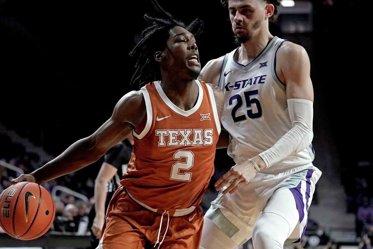 Texas guard Marcus Carr, who finished with 19 points, seven rebounds and five assists, works against K-State’s Ismael Massoud.