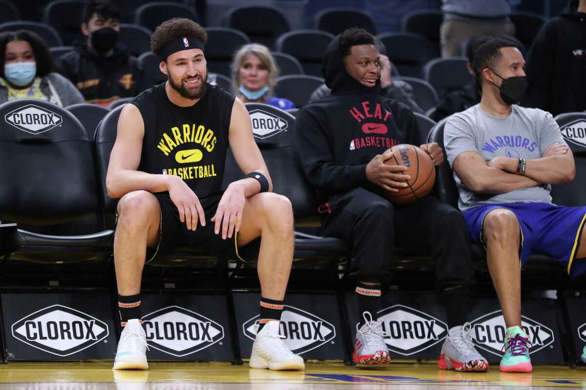 Golden State Warriors' Klay Thompson and Miami Heat's Kyle Lowry before NBA game at Chase Center in San Francisco, Calif., on Monday, January 3, 2022. Tickets for Sunday’s game, when Thompson is expected to make his return from injury, are selling for thousands of dollars.