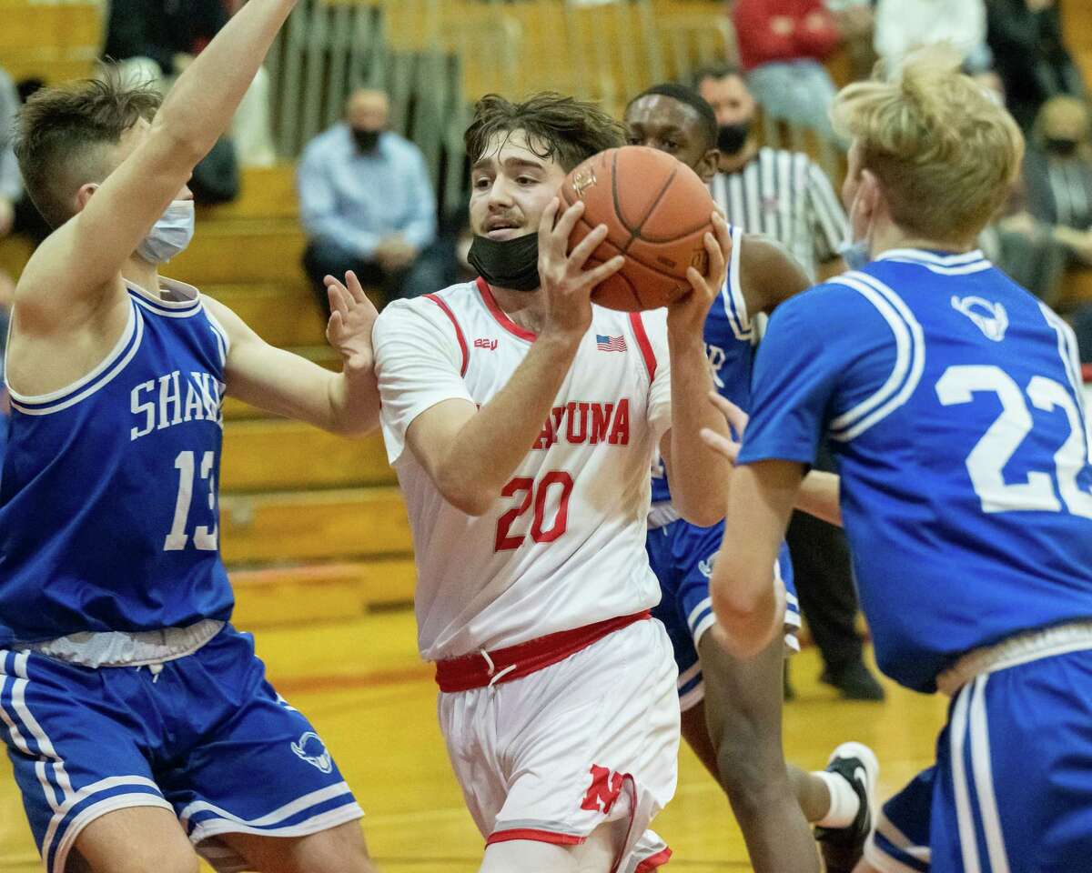 Niskayuna senior Gabe Eldaye drives to the basket between Shaker junior Collin Johnson (No. 13) and junior Andrew Church(No. 22) during a Suburban Council matchup at Niskayuna High School on Tuesday, Jan. 4, 2022. (Jim Franco/Special to the Times Union)