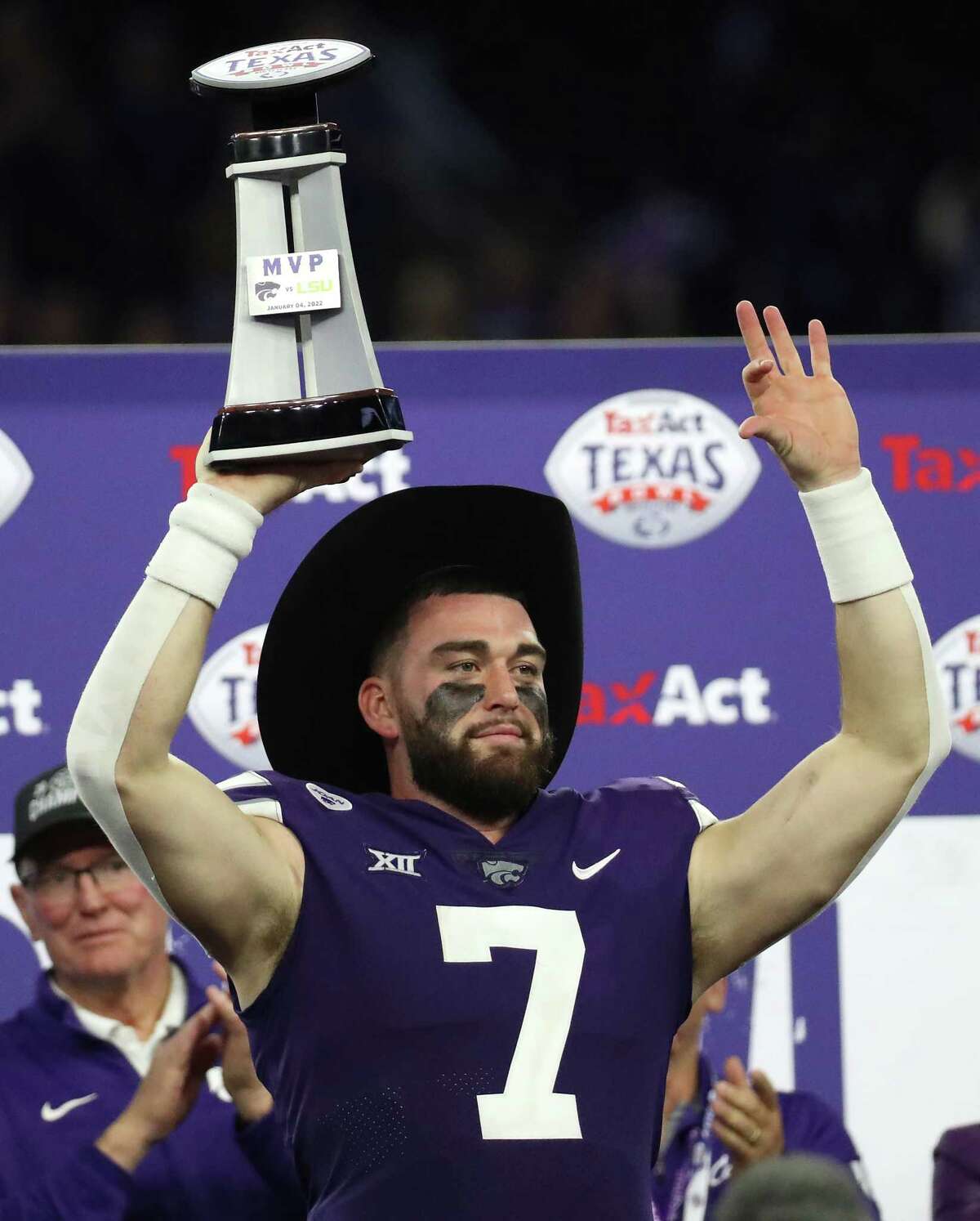 Kansas State quarterback Skylar Thompson dons the MVP cowboy hat and holds up the trophy after he lead the Wildcats to a 42-20 win over LSU in the TaxAct Texas Bowl Tuesday, Jan. 4, 2022, in Houston.