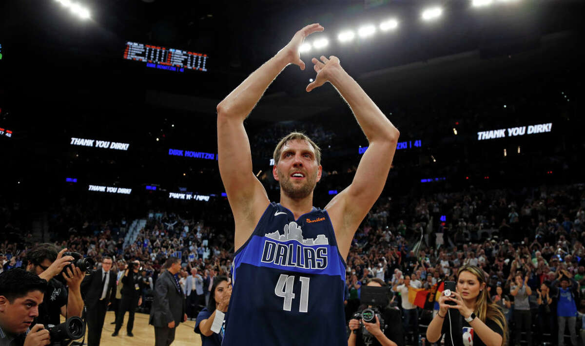 Dirk Nowitzki #41 of the Dallas Mavericks acknowledges fans at the end of his last game against the San Antonio Spurs at AT&T Center on April 10, 2019. (Photo by Ronald Cortes/Getty Images)