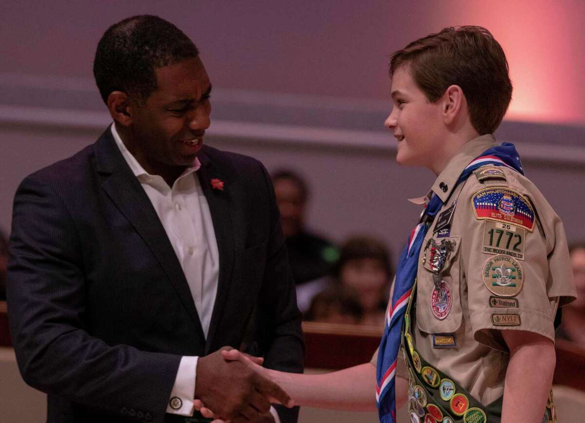 Eagle Scout Rafe Kotolik shakes hands with senior pastor Roche Coleman as he receives the Drum Major Award during the annual Dr. Martin Luther King Jr. Celebration on Jan. 21, 2019 at The Woodlands United Methodist Church.
