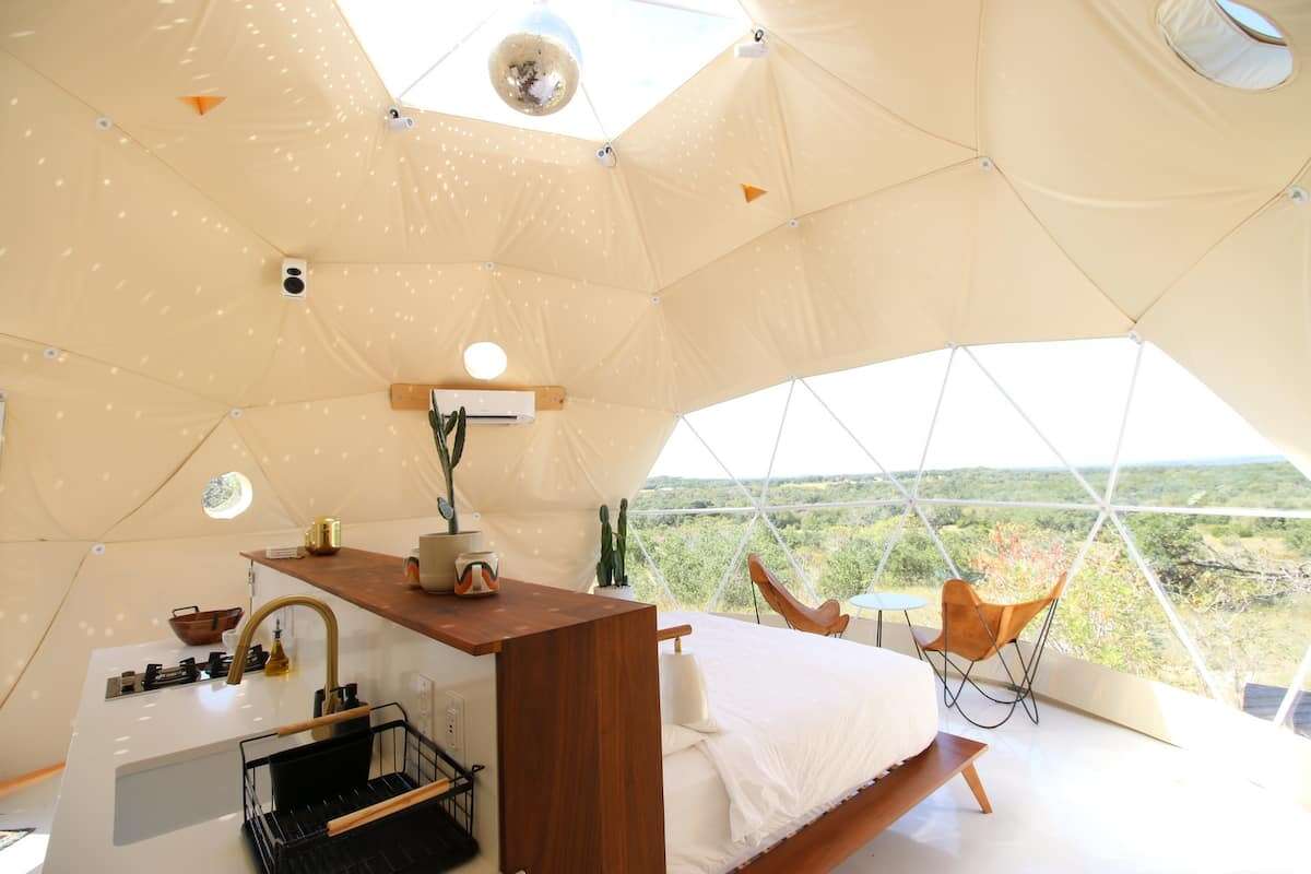 The dome is covered in specked lights from a giant disco ball. With the flip of a switch, the ball spins over a king-size bed, tunes start playing, and the lights provide a party-like atmosphere without even stepping inside a crowded club.