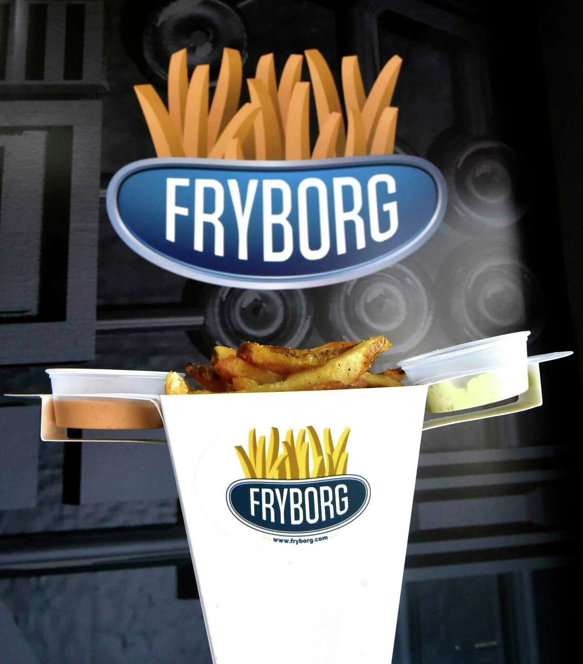 A serving of french fries with dipping sauces at Fryborg in Milford, an eclectic eatery featuring hand-cut french fries as the main attraction with variation of flavorings and dipping sauces on a menu that also includes sandwiches.