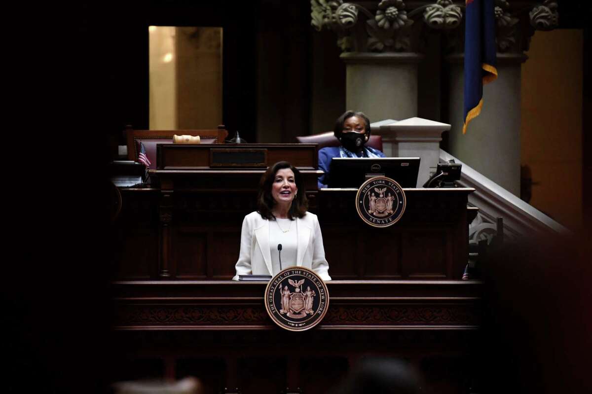 Gov. Kathy Hochul delivers her first State of the State address from the Assembly Chamber on Wednesday, Jan. 5, 2022, at the Capitol in Albany, N.Y. Senate Majority Leader Andrea Stewart-Cousins listens from above, right.