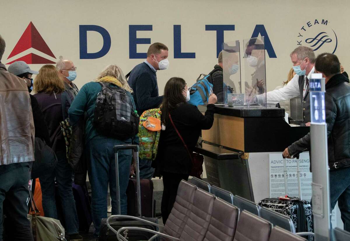 Passengers board the first Delta Air Lines flight with non-stop service from Albany International Airport to New York's LaGuardia Airport at Albany International Airport on Wednesday, Jan. 5, 2022 in Colonie N.Y.