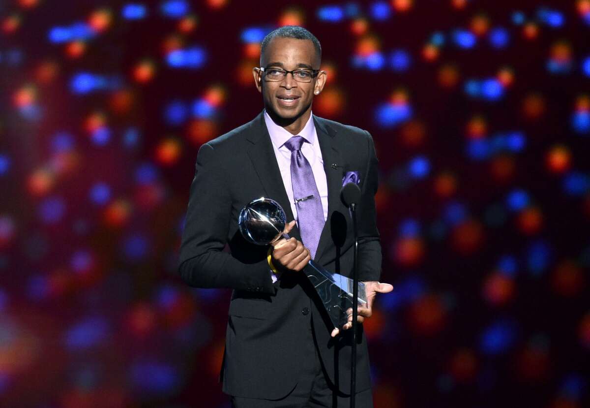 FILE - In a July 16, 2014 file photo, sportscaster Stuart Scott accepts the Jimmy V award for perseverance, at the ESPY Awards at the Nokia Theatre, in Los Angeles. (Photo by John Shearer/Invision/AP, File)