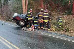 A crash in Westport, Conn., on Wednesday, Jan. 5, 2022. Fire and police officials across the state are urging drivers to stay off the roads due to icy conditions this morning.