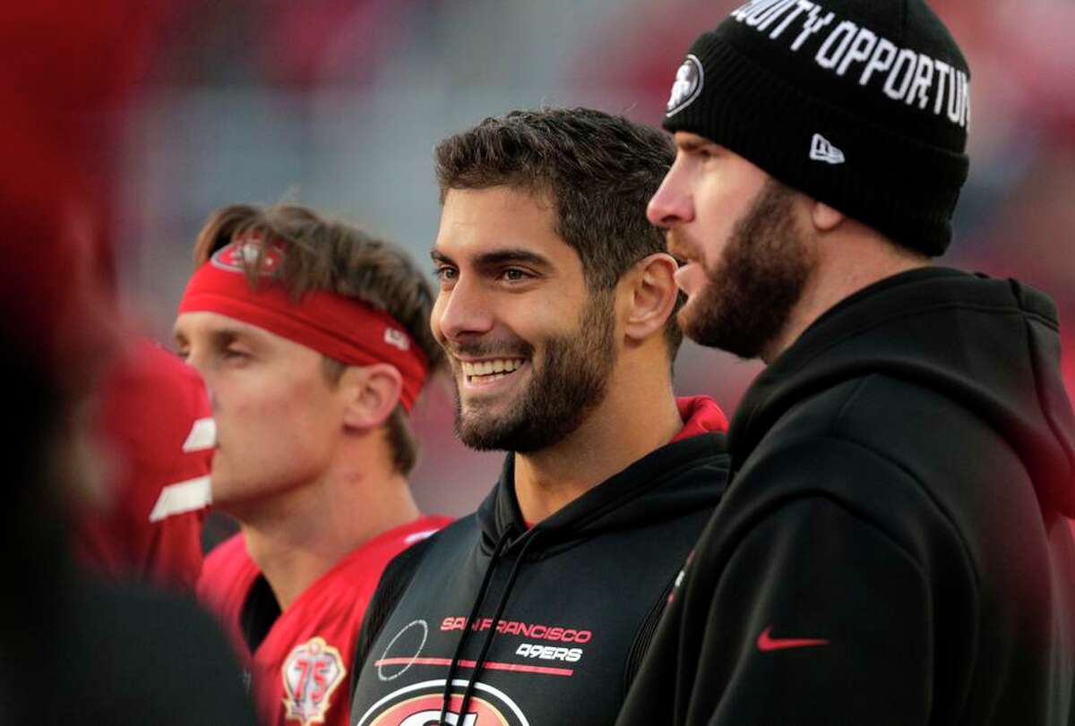 Jimmy Garoppolo (middle) was sidelined Sunday because of a thumb injury but could play against the Rams this weekend.