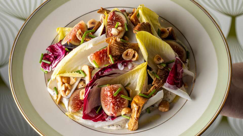 Fig and Endive Salad;chantrelle conserva, truffle aioli, crushed hazelnut at Allium Eatery in Westport, CT on November 21, 2021.