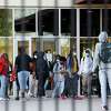 Students exit Yates High School after the first day of class following HISD’s winter break on Monday, Jan. 3, 2022, in Houston. Nearly a quarter of the district’s student population was absent Monday, the district said Wednesday.