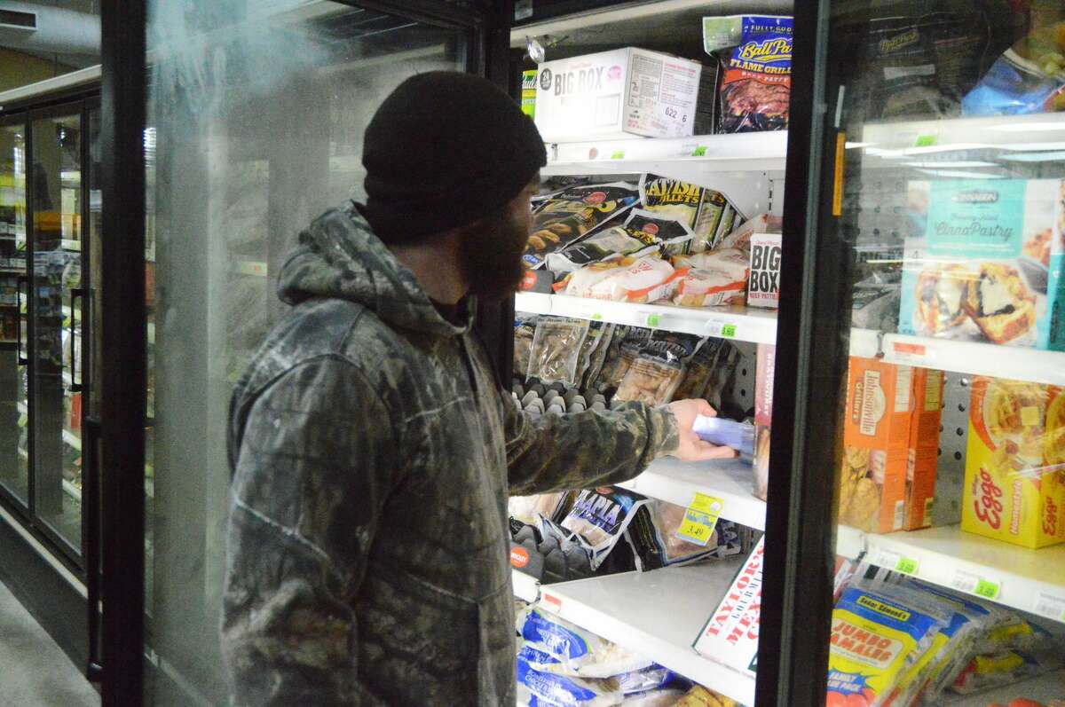 Edwardsville resident Matt Stern shops at Joe's Market Basket in Edwardsville to prepare for the cold and potentially snowy weather on Wednesday night and into Thursday morning.