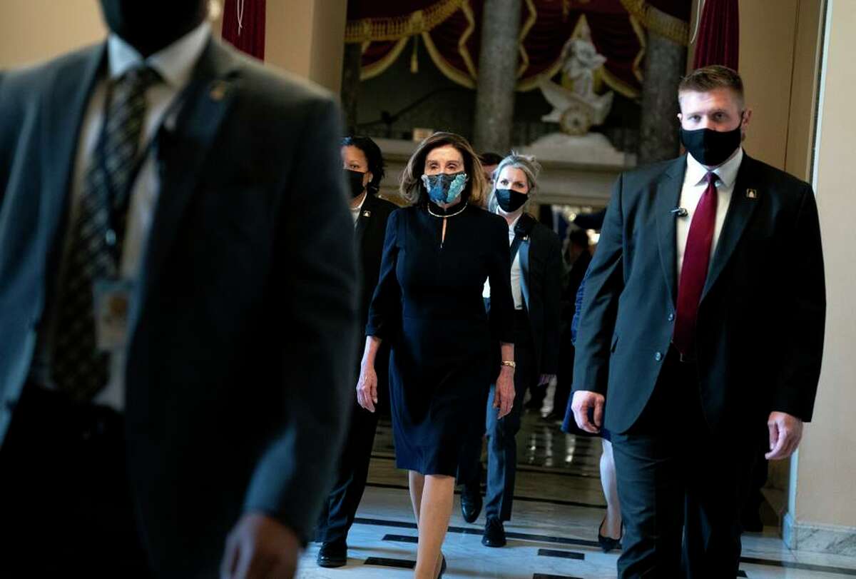Speaker Nancy Pelosi walks to the House chamber during the second impeachment trial of President Donald Trump.