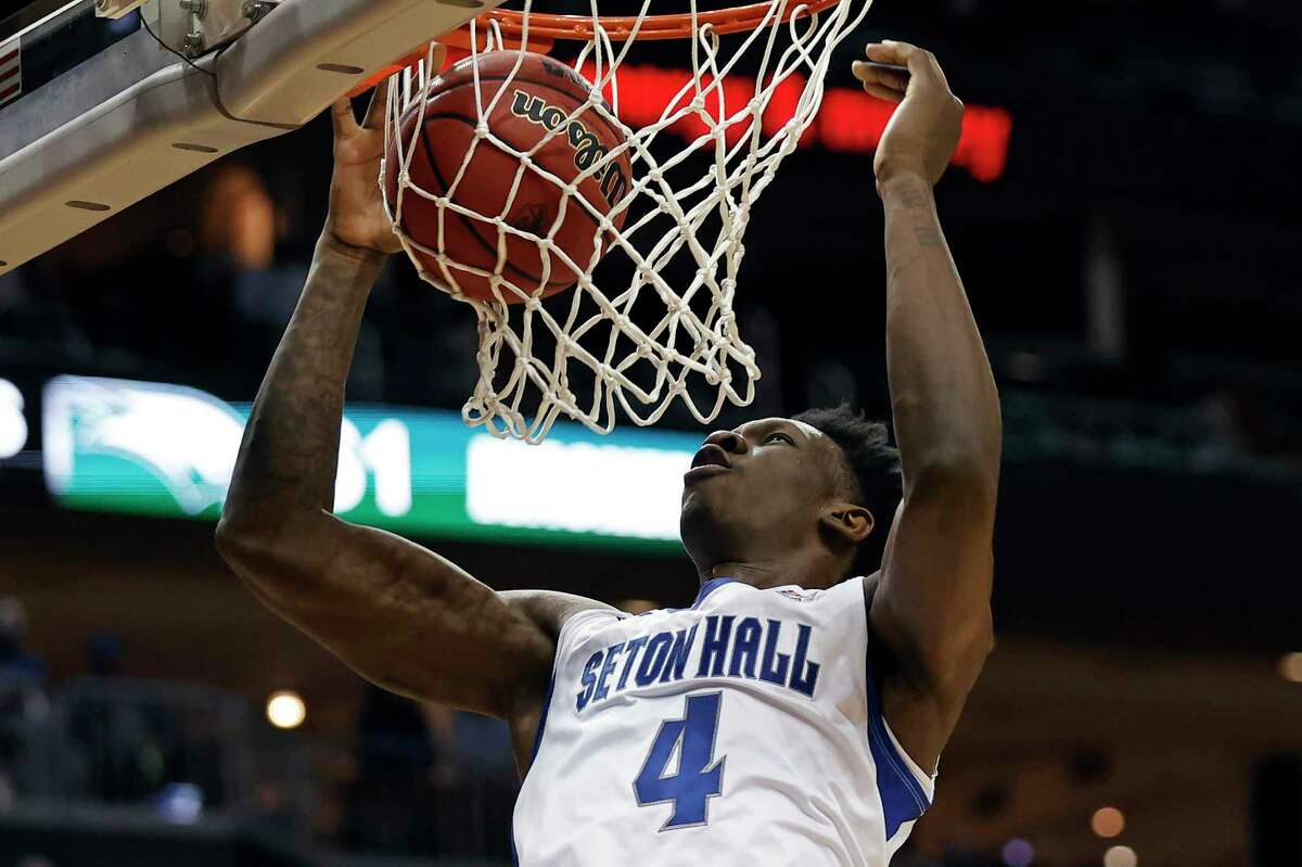 Seton Hall forward Tyrese Samuel dunks the ball against Wagner during the second half of an NCAA college basketball game Wednesday, Dec. 1, 2021, in Newark, N.J. Seton Hall won 85-63. (AP Photo/Adam Hunger)