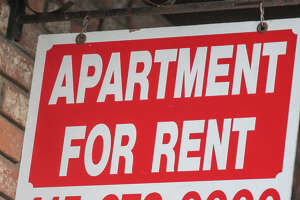 A for rent sign hangs outside an apartment building in San Francisco, Calif. on Jan. 4, 2022.