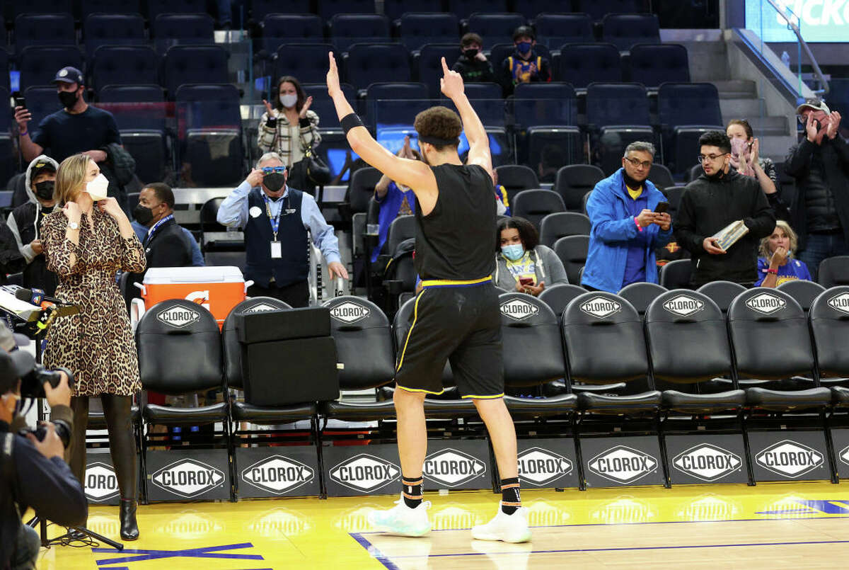 Klay Thompson of the Golden State Warriors motions to the fans after shooting around before their game against the Miami Heat at Chase Center on Jan. 3, 2022 in San Francisco.