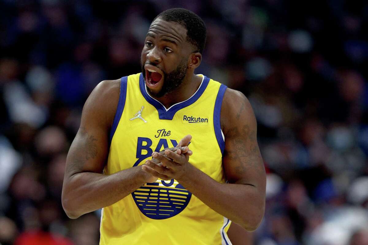 Draymond Green of the Golden State Warriors reacts after being fouled in the third quarter at American Airlines Center in Dallas on January 5. Green will miss at least the next two weeks with left calf soreness and a disc issue in his lower back.