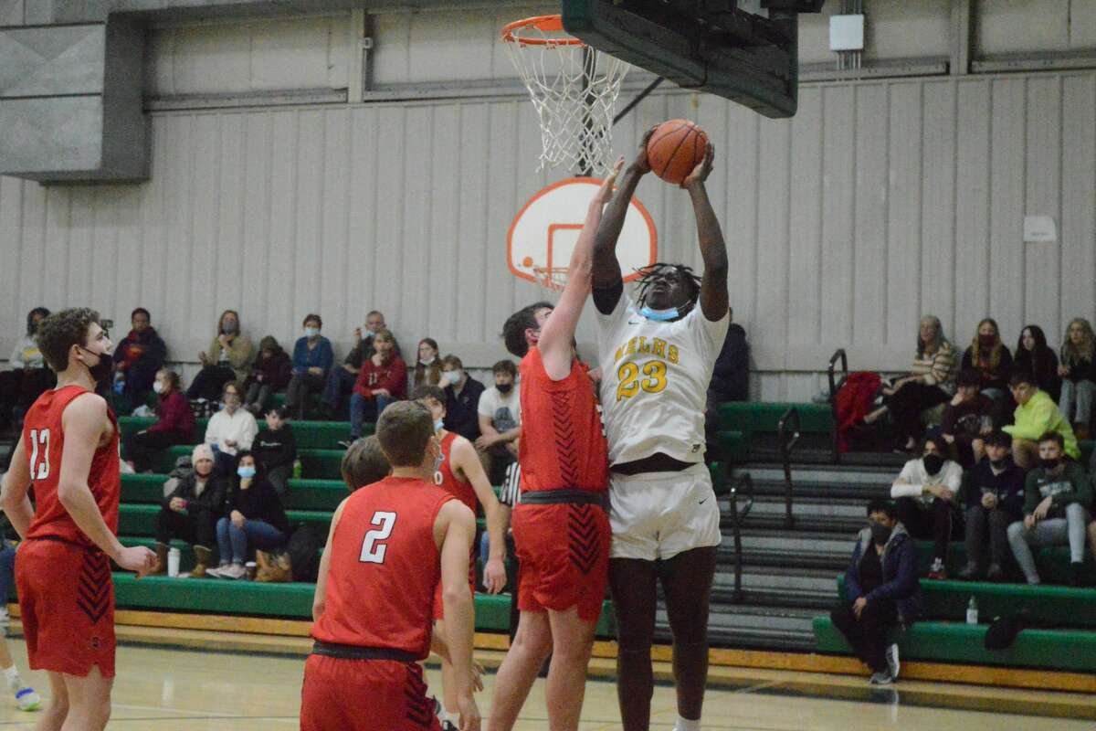 DeMarkus Bean (23) finishes a layup against Triad. Bean scored 12 points in the 59-52 loss on Wednesday. 