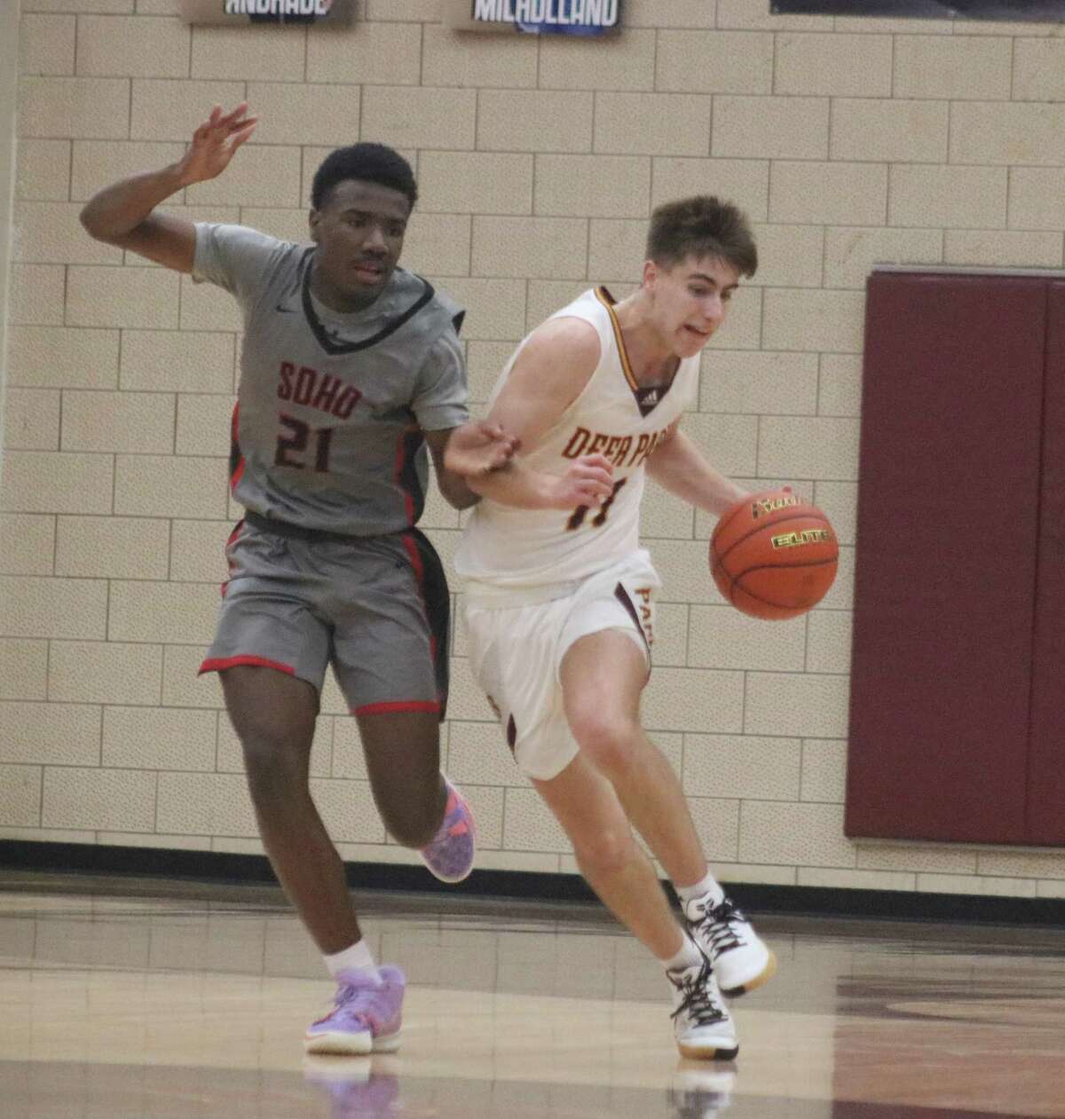 Deer Park's Garrett Topping is shadowed by South Houston's Josiah Ware as Topping brings the ball up the floor during Wednesday night's 22-6A contest.