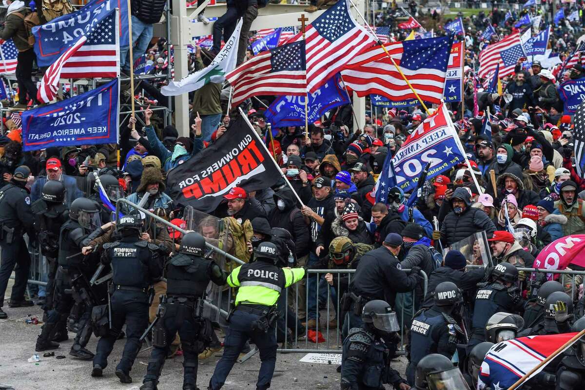 Trump supporters clash with police and security forces as they storm the U.S. Capitol in Washington, D.C., on Jan. 6, 2021.