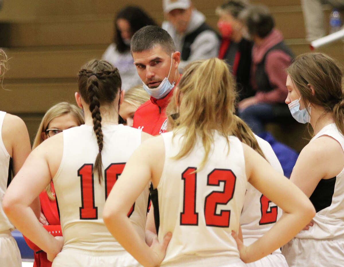 Calhoun coach Mark Hillen (center) talks to his Warriors during a game against Williamsville on Dec. 27 at the Carlinville Holiday Tourney.