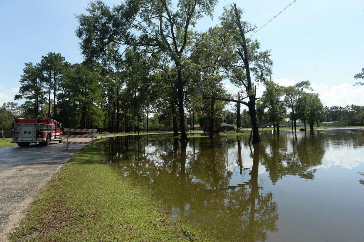 Flood waters have largely receded but still come up to the roadway on Sweet Gum in Bevil Oaks, whose evacuation order was lifted late Sunday. Many residents were already in the process of clearing out and gutting their homes Monday morning. Photo taken Monday, September 23, 2019 Kim Brent/The Enterprise