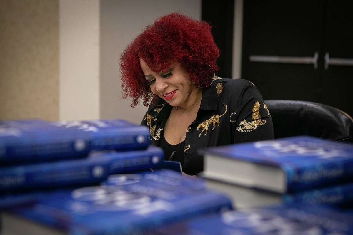 Pulitzer Prize-winning investigative journalist Nikole Hannah-Jones signs copies of her book, “The 1619 Project: A New Origin Story.”