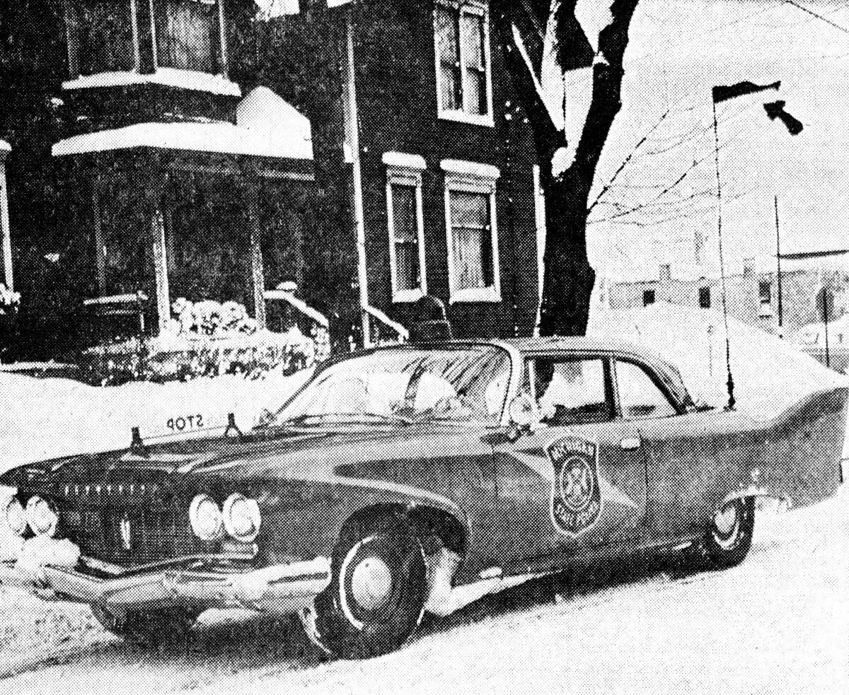 Michigan State Police is advising motorists to attach a red flag to their aerial antenna as shown here so that they may be seen when approaching intersections with high snow bans. The photo was published in the News Advocate on Jan. 13, 1962.