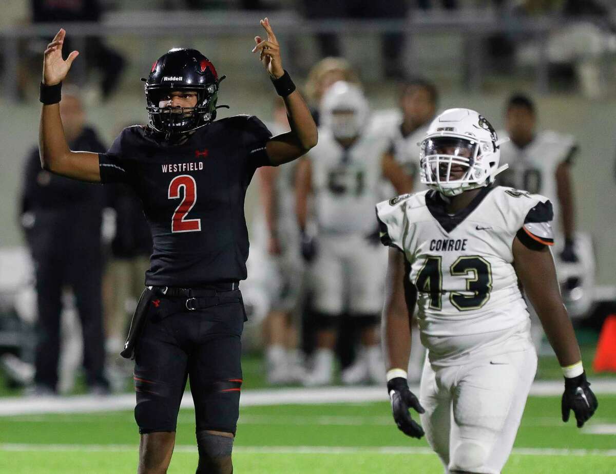 Westfield quarterback Cardell Williams (2) celebrates after a 15-yard touchdown by running back Dahmeir Scott in the third quarter of a Region II-6A (Div. 1) bi-district high school football game at Planet Ford Stadium, Thursday, Nov. 11, 2021, in Spring.