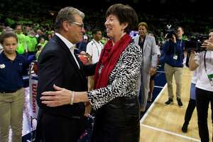 Connecticut head coach Geno Auriemma, left, and Notre Dame head coach Muffet McGraw shakes hands before an NCAA college basketball game Sunday, Dec. 2, 2018, in South Bend, Ind. Connecticut won 89-71. (AP Photo/Robert Franklin)