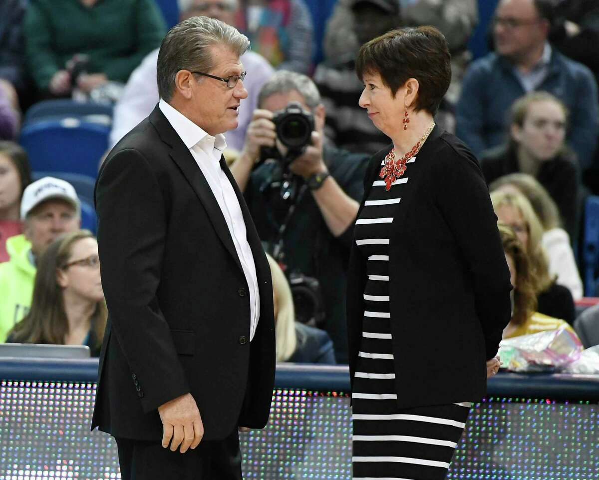 UConn coach Geno Auriemma, left, talks with Notre Dame coach Muffet McGraw before a 2017 game. The long-running beef between Auriemma and McGraw reared its head again this past week.