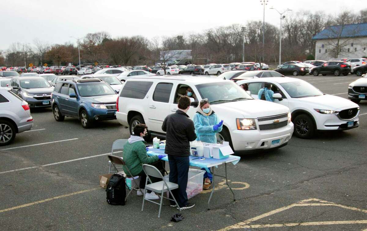 Hundreds of area residents came to Cove Island Park to get tested for COVID ahead of the holidays in Stamford, Conn., on Tuesday December 21, 2021. Sema4 was running the COVID test clinic at Stamford High School's parking lot on Monday, but traffic congestion forced the site to move to Cove Island Park.