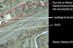 A used car dealership has won approval in Danbury to convert four properties into a single lot near Interstate 84’s Exit 6.