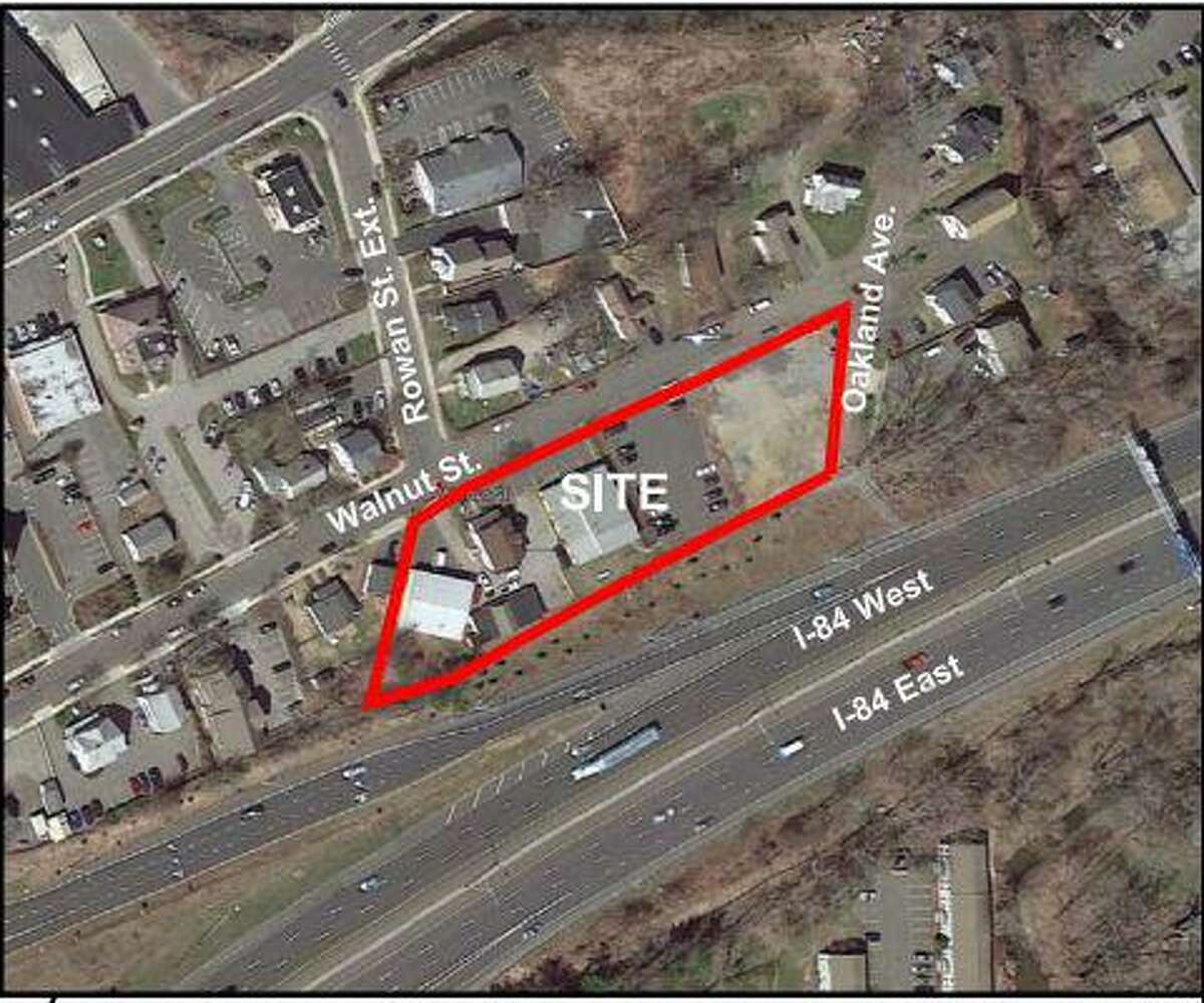 A used car dealership has won approval in Danbury to convert four properties into a single lot near Interstate 84’s Exit 6.