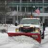 A plow clears snow at Harbor Point in Stamford, Conn. Thursday, Feb. 18, 2021. The area is slated to receive 4 to 7 inches of snow late Thursday, prompting several school closures.