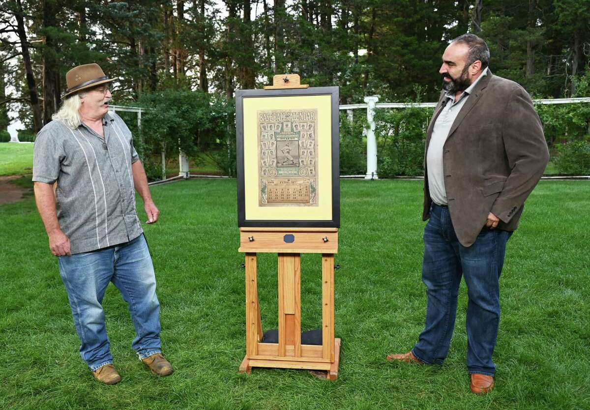 PBS’s Antique Roadshow launched its 26th season Monday with a visit to Middletown’s Wadsworth Mansion Aug. 10. Here, Simeon Lipman, right, appraises a 1917 Boston Red Sox baseball calendar.