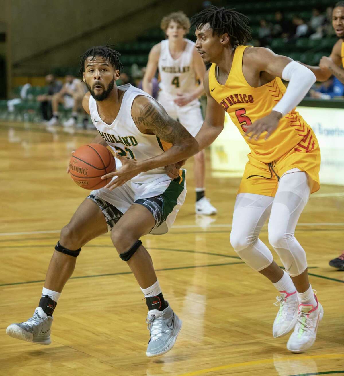 Midland College's Steven Richardson drives to the basket as New Mexico Junior College's Elijah Hoard defends 01/06/2022 at the Chaparral Center. Tim Fischer/Reporter-Telegram