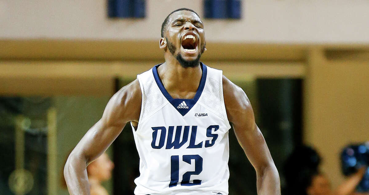 Rice Owls guard Carl Pierre (12) celebrates after scoring a three point basket against the Texas State Bobcats during the first half of an NCAA game at Tudor Fieldhouse on Tuesday, Nov. 30, 2021, in Houston.